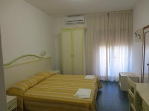Postel nebo postele na pokoji v ubytování Hotel Due Torri
