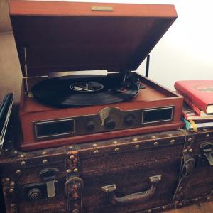 a record player sitting on top of two suitcases at Vintage touch apartment in Cluj-Napoca