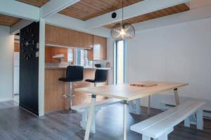 a dining room with a table and two chairs at Chalet Mont Sainte-Anne in Beaupré