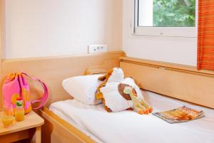 Postel nebo postele na pokoji v ubytování ibis Mulhouse Centre Filature