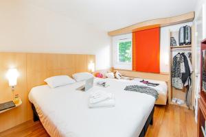 Postel nebo postele na pokoji v ubytování ibis Mulhouse Centre Filature