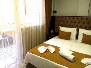 Кровать или кровати в номере Yasin Apart hotel