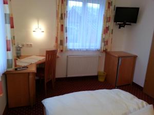 Postel nebo postele na pokoji v ubytování Gasthof Zur Post