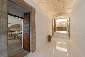 a living room with a hallway with a ceiling at Asisium Boutique Hotel in Assisi