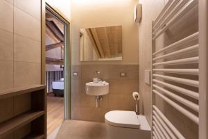 a bathroom with a white toilet and a sink at Residence 8 Loft in Venice +129 photos