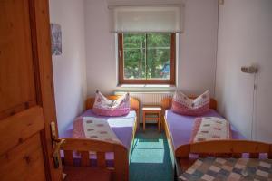 Postel nebo postele na pokoji v ubytování Apartmany Harrachov