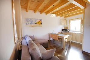 a living room with a couch and a table at "Domki na Miłej "Niechorze in Niechorze