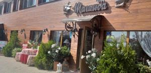 a flower shop with a sign on the front of it at Shalanda in Odesa