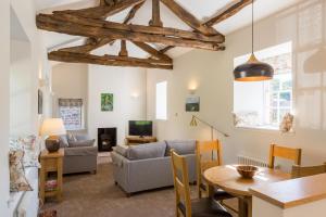 uma sala de estar com um sofá e uma mesa em Netherby Hall em Carlisle