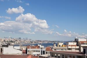 a view of a city with buildings and the water at Hotel Queens Land in Istanbul