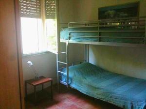 A bed or beds in a room at Villa Dei Pini IUN S3571