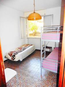 A bed or beds in a room at Villa Dei Pini IUN S3571