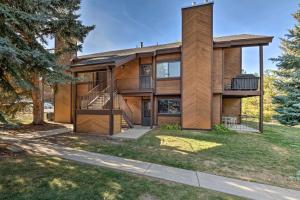 una casa in legno con un albero di Park City Condo at Canyons Village with Amenities! a Park City