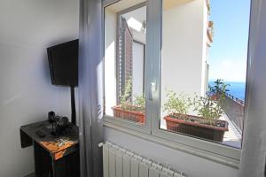 Televízia a/alebo spoločenská miestnosť v ubytovaní casa cloe