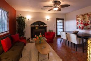 a living room with a couch and a table at Villa Cristine - Spanish Style Palm Springs Villa in Palm Springs