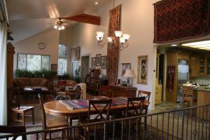a dining room and living room with a table and chairs at Harmony Belle at Kolob Canyon in New Harmony