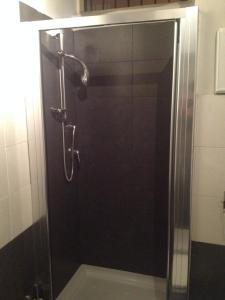 a shower with a glass door in a bathroom at B&B Domus Dei Cocchieri in Palermo +33 photos