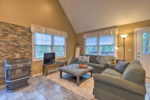 a living room with a couch and a fire place at Year-Round Getaway Less Than 1 Mi to Skiing and Waterpark! in McGaheysville