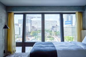 Rúm í herbergi á The Tower Hotel Nagoya