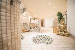 A seating area at Apparthotel Feldhof - Living and Bistro