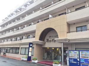 a large building with a store on a street at Sky Heart Hotel Kawasaki - Vacation STAY 97869 in Kawasaki