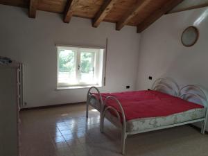 Postel nebo postele na pokoji v ubytování Agriturismo Val di Ferro