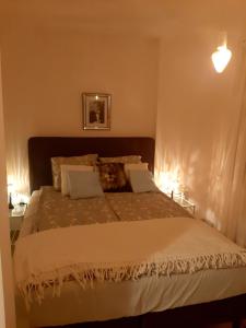 a dog laying on a bed in a bedroom at Hollywood Apartament Kosciuszki in Łódź