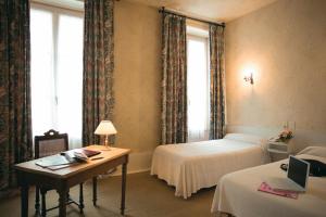 Postel nebo postele na pokoji v ubytování Hotel Du Nord
