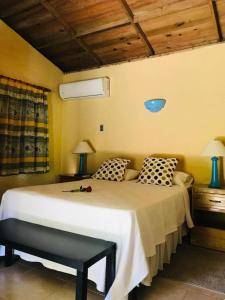a bedroom with a large white bed in a room at Hotel Playazul in Santa Cruz de Barahona