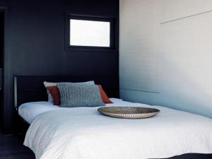 En eller flere senge i et værelse på Black Shack on Hyams Beach