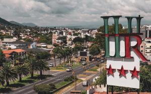 a city with a large sign that reads rr at Riviera Hotel & Spa in Villa Carlos Paz