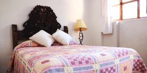Postel nebo postele na pokoji v ubytování Hotel Sautto