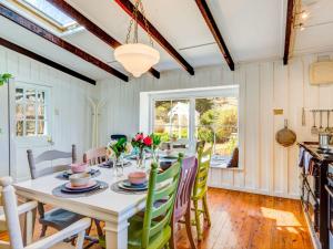 a dining room with a table and chairs at Mirriyindi for 7 Berrima in Berrima