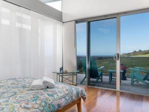 Tasman Drive Gerringong tesisinde bir odada yatak veya yataklar