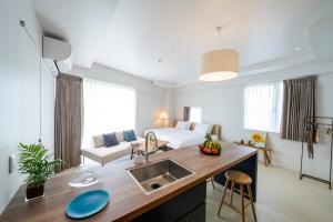 Posezení v ubytování HOTEL PETIT SUITE SOGENJI ISHIMON