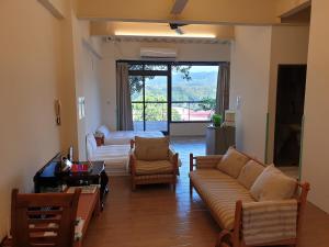 Un lugar para sentarse en Sanyi Happiness B&B