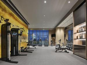 a gym with treadmills and exercise equipment in a building at Crowne Plaza Qidong, an IHG Hotel in Qidong