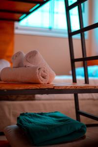 a pile of towels sitting on a shelf at Cabañas del Cerro in Valle Grande