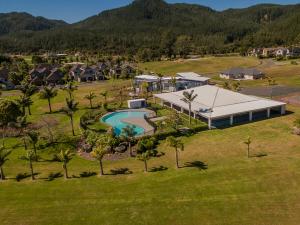 an aerial view of a house with a swimming pool at Villa 51 - Pauanui Holiday Home in Pauanui
