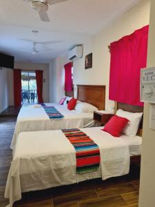 Hotel Machos Mahahual客房内的一张或多张床位