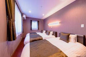 Postel nebo postele na pokoji v ubytování 06 Resort Club -粋IKI-