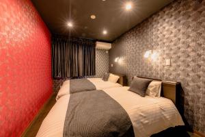Postel nebo postele na pokoji v ubytování 06 Resort Club -粋IKI-