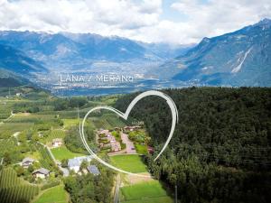 an aerial view of a heart shaped hotel at Alpwellhotel Burggräfler in Tesimo