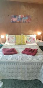 Ένα ή περισσότερα κρεβάτια σε δωμάτιο στο Homestay On Queen