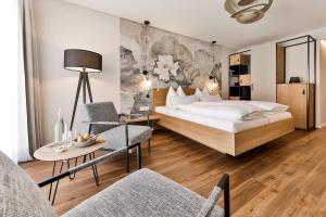 Postel nebo postele na pokoji v ubytování WeinHotel Fritz Walter