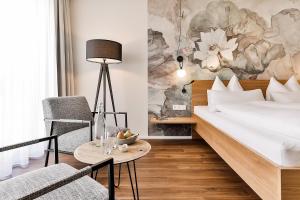 Postel nebo postele na pokoji v ubytování WeinHotel Fritz Walter
