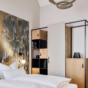 Postel nebo postele na pokoji v ubytování WeinHotel Fritz Walter