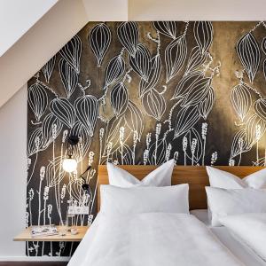 Postel nebo postele na pokoji v ubytování WeinHotel Fritz Walter