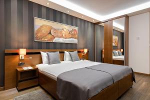 Rubicon Garni Hotel客房内的一张或多张床位
