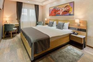 Rubicon Garni Hotel客房内的一张或多张床位